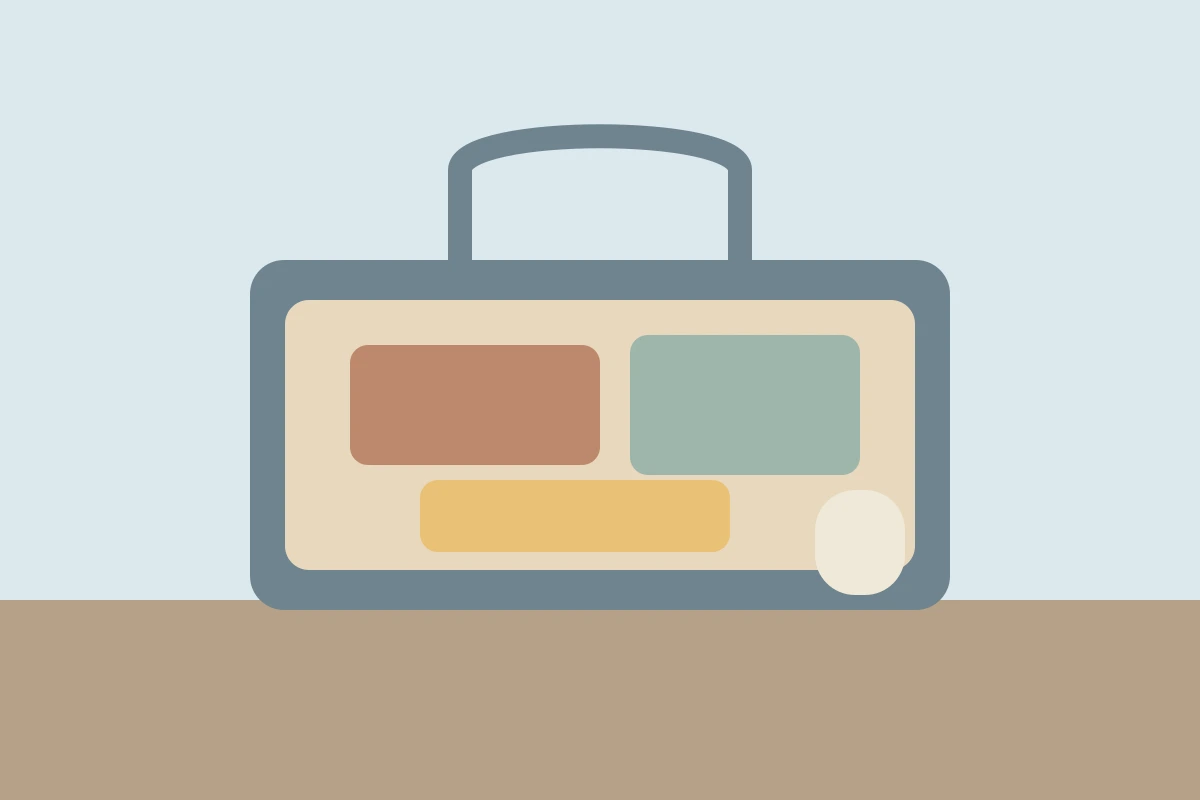 A carry-on with a travel notebook, charging cable, folded layer, and first-day essentials nearby